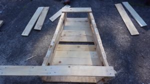 To get your next side the exact same angle, lay your legs on top of the last piece's legs, as shown. When you are happy that they are aligned, add a timber top and bottom, and use two screws on each join.