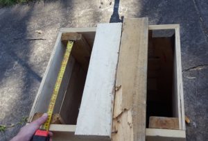 Measure the distance between the top of your legs, and cut two pieces of scrap to fit. You can do this in either direction, your finished, visible lid slats will lay perpendicular (90 degrees) to this measurement.